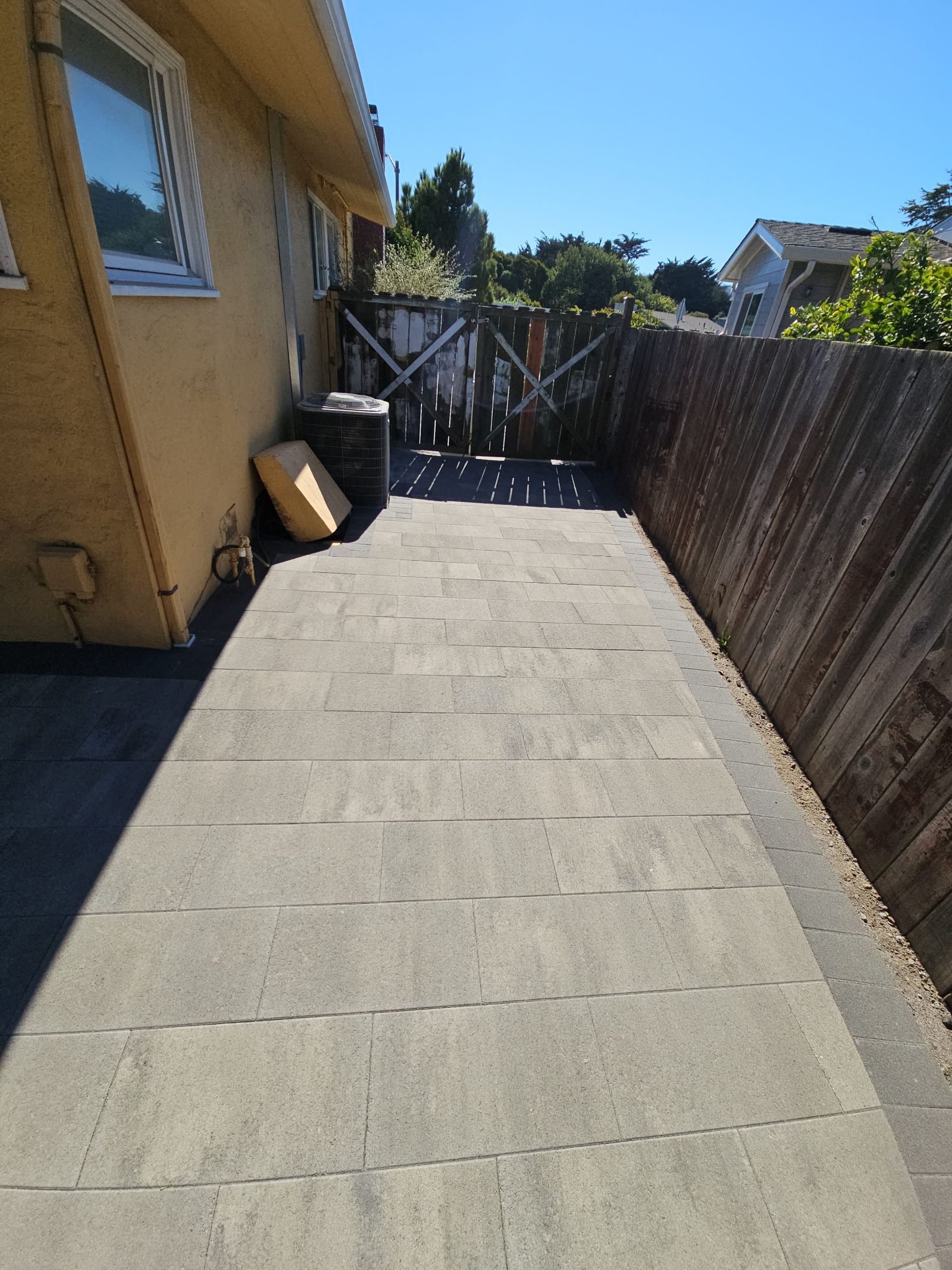 Paver path along the side of the house to the yard gate